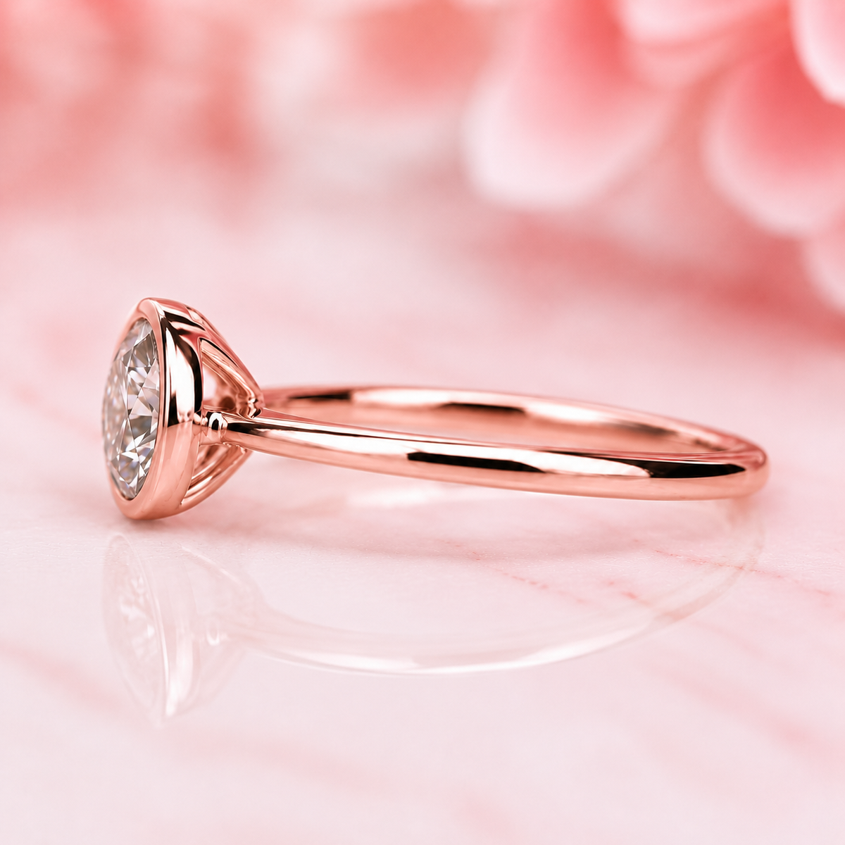 Bezel set round lab grown diamond solitaire engagement ring in rose gold