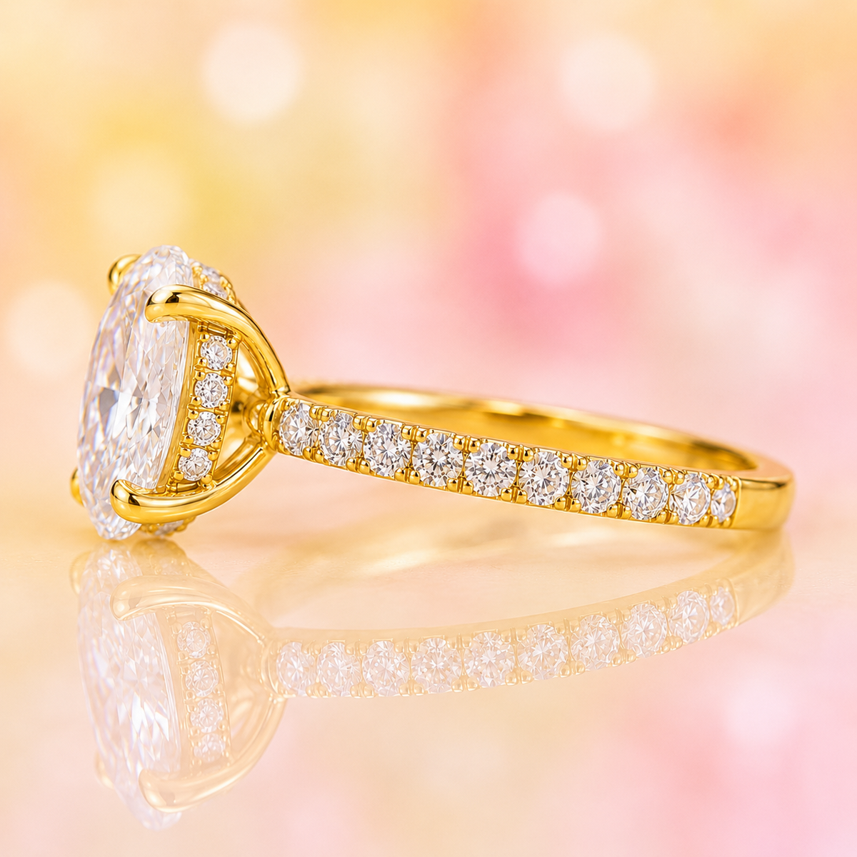 Oval lab grown diamond engagement ring with hidden halo and pave band in yellow gold