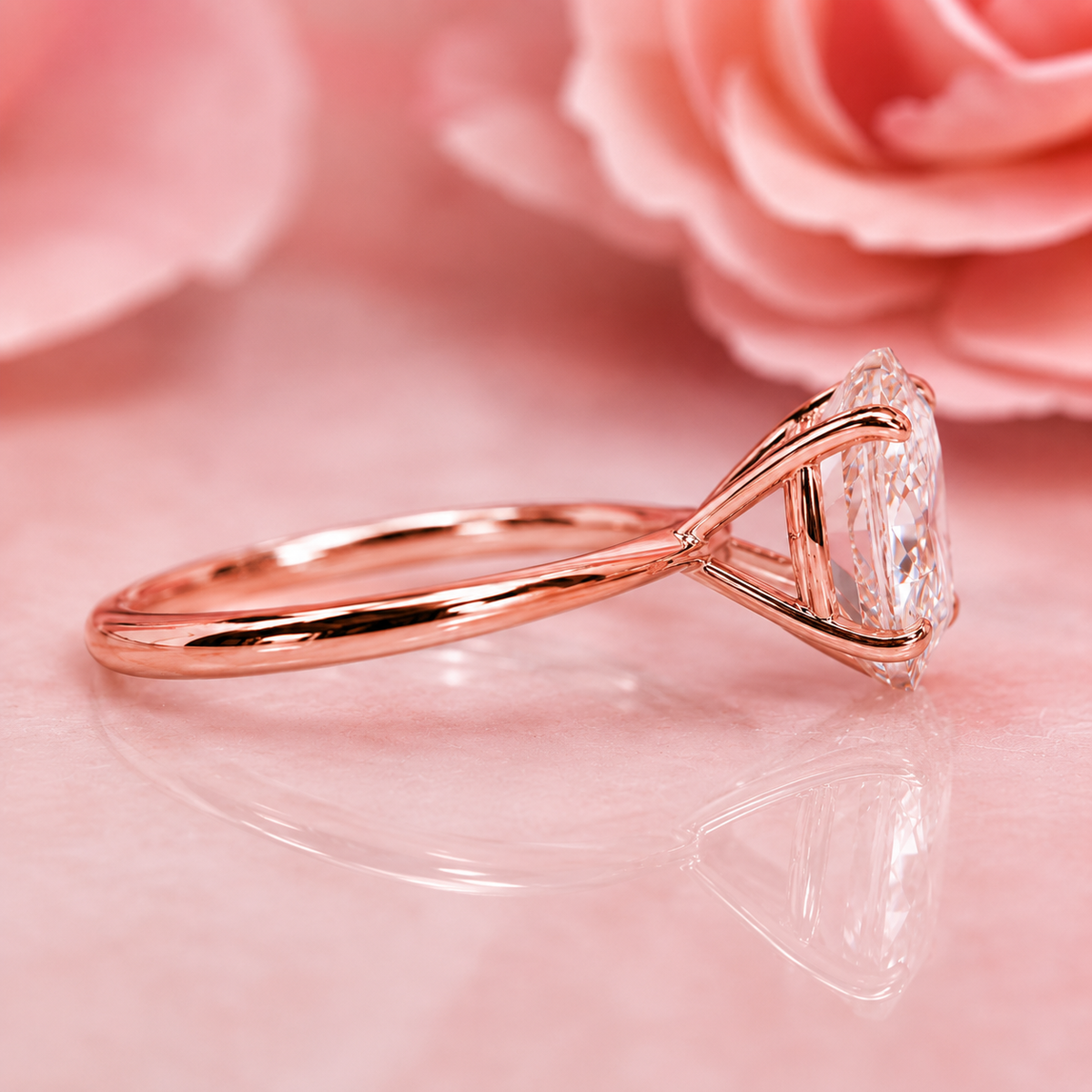 Oval solitaire engagement ring with tapered shank in rose gold