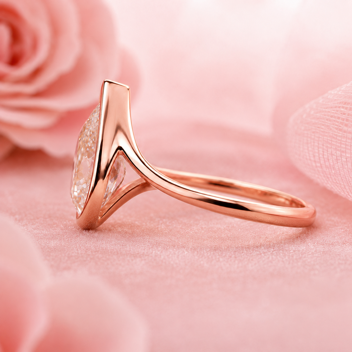 Pear shaped engagement ring with timeless and unique design in rose gold